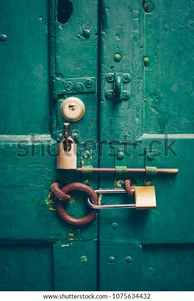 Old Green Door Behind Many Locks Stock Photo Edit Now