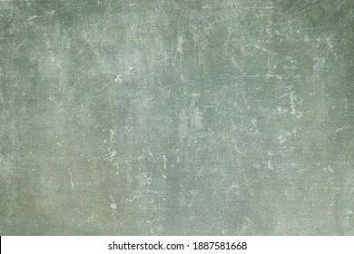 Old green grungy wall background or texture 