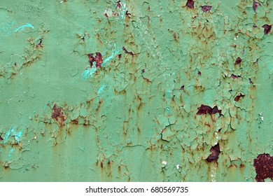 Old Green Paint On The Metal And Drips Of Rust