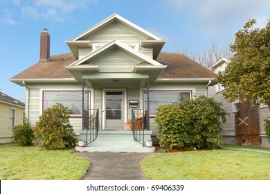 Old Green Small Home With Porch