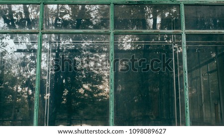 Similar – View through the reflective pane over a terrace onto the coast of Western Canada