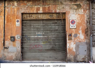 Old Grey Garage Door at a old house - Shutterstock ID 110918066