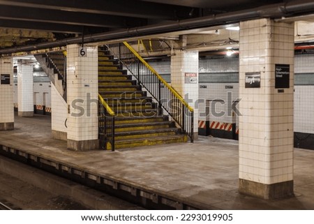 Old grimey staircase leading to underground subway station in Manhattan New York