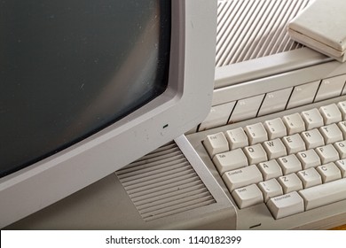 Old Grubby Outdated Tech. Close-up Of A Vintage Computer System. Dirty Retro Keyboard, Hard Drive, Crt Moniter And Mouse.