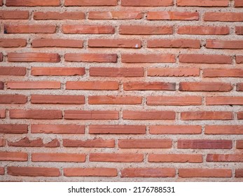 Old grunge brick wall background red color. High quality photo
