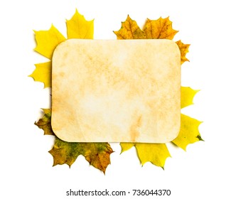 Old grunge paper page over fall leaves isolated on white. Clipping path - Powered by Shutterstock