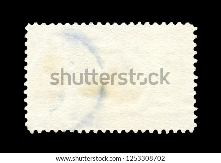Old grunge posted stamp, reverse side