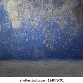 old grunge room with concrete wall, blue background