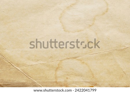 Old grunge stained paper for background
