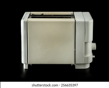 Old Grunge Toaster Over Black Background