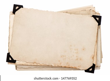 old grungy paper sheets isolated on white background. photo card with black corner