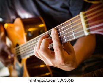 The Old Guitar In A Coffee Shop