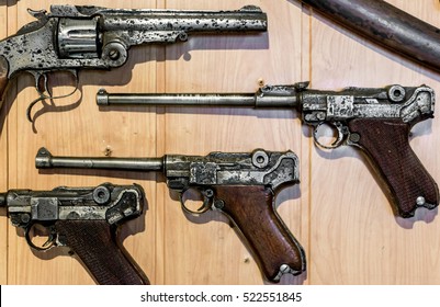 Old Gun - Parabellum And Revolver On The Wall