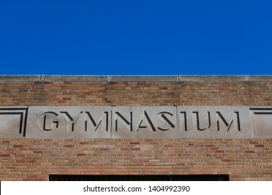 Old Gymnasium Sign On A School Building