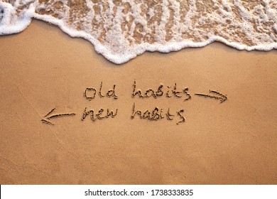 old habits vs new habits, life change concept written on sand - Shutterstock ID 1738333835