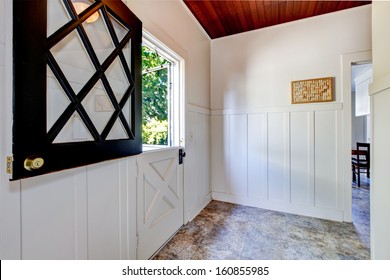 Old Half Cut Door With Mud Room And White Wall Molding. American Traditional Home Interior. 