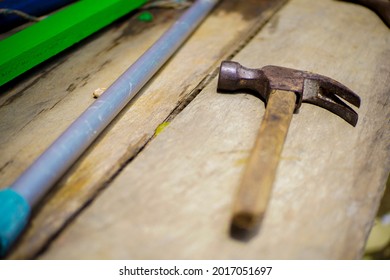 The Old Hammer On The Table That Looks No Longer Needed