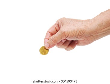 Old Hand Of Female Elderly Holding A Golden Coin