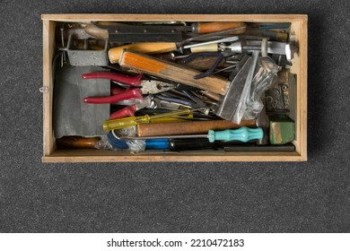 Old Hand Tools In Wooden Box On Black Background