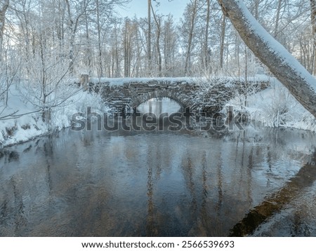 An old hand-built stone bridge over the river