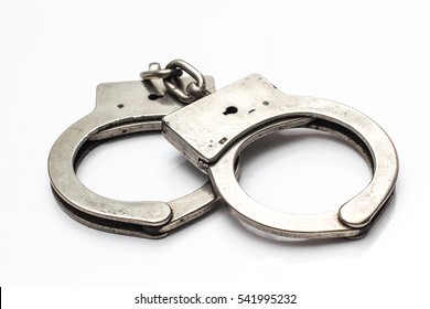 Old Handcuffs On White Background