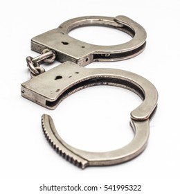 Old Handcuffs On White Background