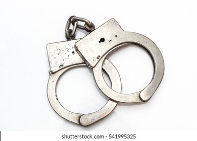 Old Handcuffs On White Background