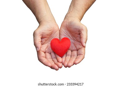 Old Hands Of The Elderly Giving A Red Heart