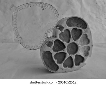 Old Heart Shaped Eyeshadow Makeup Kit In A White Background. 