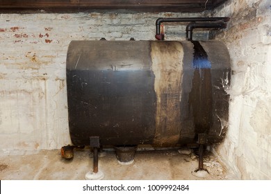 Old Heating Oil Tank In Dingy Dank Basement.