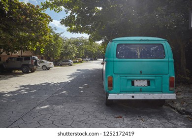 Old Hippie Van Parked At The Side Of The Road And Taken From Behind.