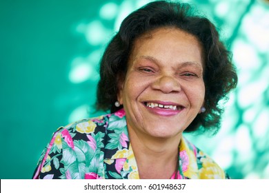 Old Hispanic Real People From Cuba With Feelings And Emotions, Portrait Of Funny Senior African American Lady Laughing And Looking At Camera. Elderly Black Woman Smiling