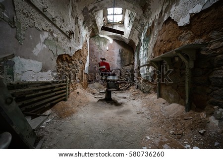 Old historic barber chair in an abandoned cell 