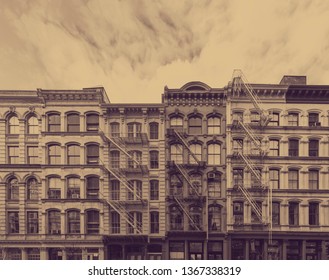 Old historic buildings in the SoHo neighborhood of Manhattan in New York City with faded sepia color effect