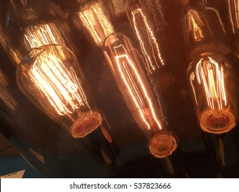 Old Historic Decorative Antique Thomas Edison Style Light Bulbs Evolution Of Technology And Light With These Three Light Bulbs Dark Diagonal 