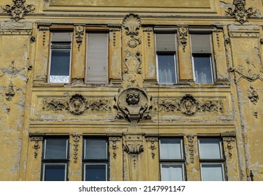 Old historical building with face bas relief in old town of Sibiu, Romania