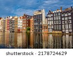 Old Historical Houses At The Canal Around Damrak Amsterdam