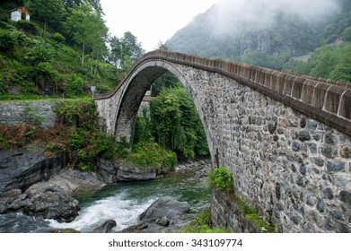 Old historical stone bridge on river under the fog at black sea region of Turkey.