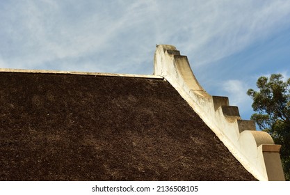 An Old Historical Thatched Roofed Building With Original Cape Dutch Gable