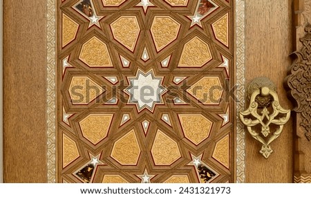 Old and historical wooden door decorated with Islamic motifs