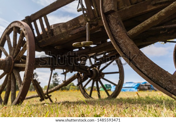 old horse cart stands on\
the field