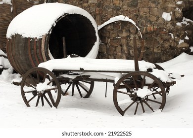 An Old Horse Drawn Carriage In The Snow