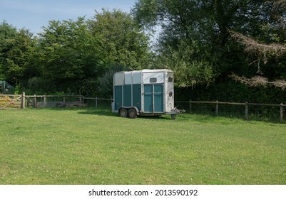 Old Horsebox for Transporting Horses Parked in a Field on a Bright Sunny Summer Day on a Farm in Rural Devon, England, UK