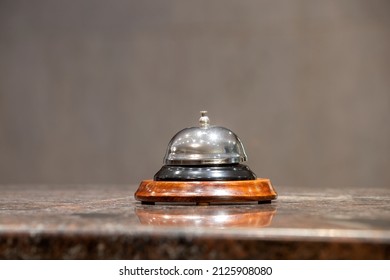 Old Hotel Bell On A Marble Stand