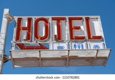 Old Hotel Sign Against The Blue Sky