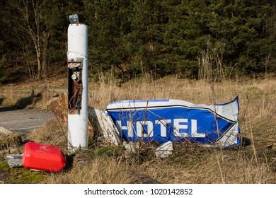 Old Hotel Signboard. A Broken Hotel And A Sign Showing Its Direction. Winter Season.