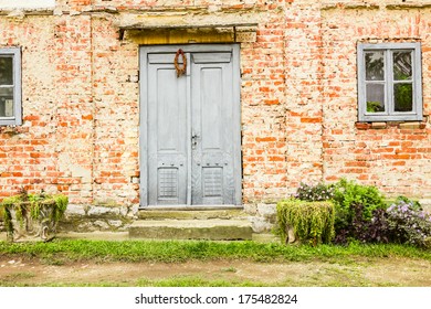 Old house brick wall with painted door and window - Powered by Shutterstock
