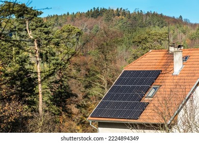 Old house in the Czech Republic with a solar panel roof in nature. Photovoltaic panels on the roof. Saving electricity. Ecological concept. - Shutterstock ID 2224894349