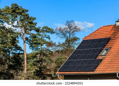 Old house in the Czech Republic with a solar panel roof in nature. Photovoltaic panels on the roof. Saving electricity. Ecological concept. - Shutterstock ID 2224894351