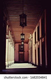 Old House Hallway With Ceiling Lamps And Sun Shades